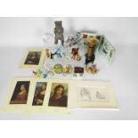 A mixed lot to include vintage money banks, paper weights, glass animals, Da Vinci prints,