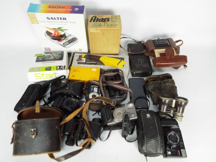Lot to include cameras, binoculars, field glasses and other.