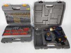 Ryobi - A cordless drill, model STP1201, contained in carry case and cased drill bit set.