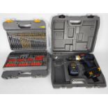 Ryobi - A cordless drill, model STP1201, contained in carry case and cased drill bit set.