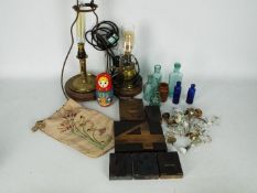 Two converted oil lamps, vintage bottles, printer's blocks, door handles and similar.