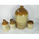 Stoneware group including two T W Parker Warrington flagons and similar,