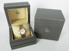 Gc Watch - a Gc Analogue wristwatch with rose gold coloured / Ion-plated strap,