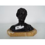 A cast metal bust of a lady in the classical style, mounted to marble plinth,