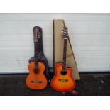 A Tanglewood Odyssey TMO-7NC bowl back electro acoustic guitar (boxed) and a Sierra acoustic guitar