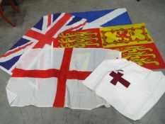 A small collection of flags to include England, Royal Standard, The Saltire, Union Flag and other.