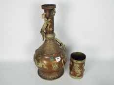 A large copper vessel with applied chilong to the shoulder and neck,