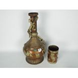 A large copper vessel with applied chilong to the shoulder and neck,