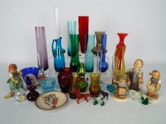 Lot to include coloured glass vases, glass animals four Hummel figurines and a Hummel plate.