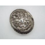 A continental white metal snuff box of oval form, stamped 800,