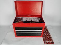 A red metal, four drawer, tool chest with contents.