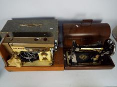 Two vintage sewing machines comprising a Singer and a Jones, both contained in carry cases.