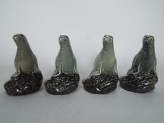 Four Beswick Beneagles miniature decanters (with contents) in the form of seals.