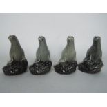 Four Beswick Beneagles miniature decanters (with contents) in the form of seals.