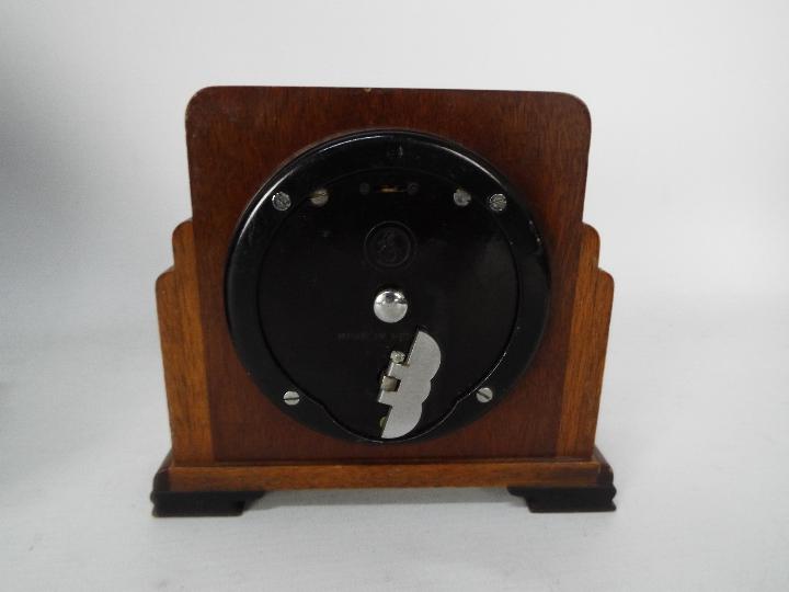 A mantel clock with key and pendulum and a small Art Deco Elliot clock. - Image 5 of 5