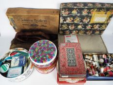 A collection of vintage sewing / crafting accessories contained over nine tins to include thread,