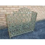 A metal fire screen approximately 86 cm x 133 cm.