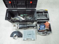 A Nu Tool angle grinder contained in toolbox, a Performance Power Pro Sandcritter sander,