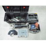 A Nu Tool angle grinder contained in toolbox, a Performance Power Pro Sandcritter sander,