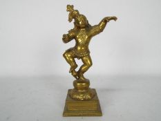 A bronze figurine depicting Krishna, approximately 22 cm (h).