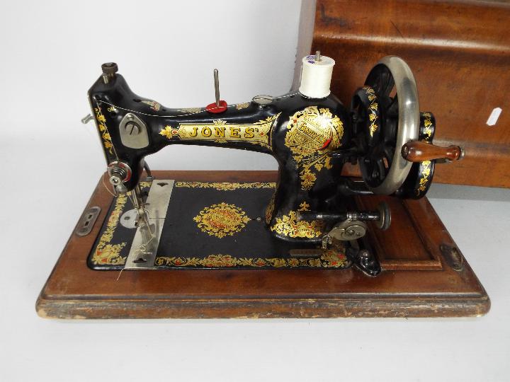 A vintage sewing machine in wooden case, Jones Family Cylinder Shuttle. - Image 2 of 3