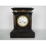 A black slate and marble mantel clock, Roman numerals to a white enamel dial,