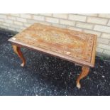 Indian coffee table with inlaid decoration, on cabriole supports,