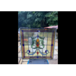 A stained glass window measuring approximately 82 cm x 84 cm.