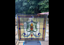 A stained glass window measuring approximately 82 cm x 84 cm.