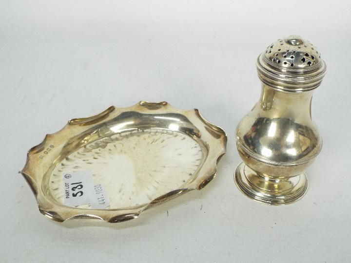 A Victorian silver trinket dish, London assay 1892 and a silver sugar caster,