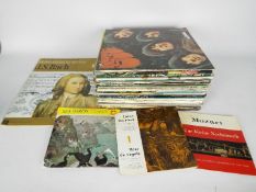A quantity of 12" vinyl records to include Bill Wyman, Paul McCartney, The Beatles, Roxy Music,