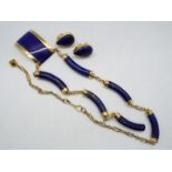 An Egyptian gold and lapis lazuli necklace and earrings set purchased from H Elwan Jewellery