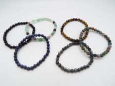 A Lapiz Lazuli Multicolour fluorite and black agate set of 6 stretchable bracelets.