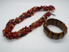 A 492ct Yellow Tiger's Eye stretchable bracelet and a Red Coral ,