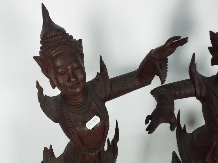 A large pair of South East Asian carved wood figures of female dancers, - Image 2 of 7