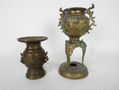 Two cast metal vases, the largest approximately 22 cm (h).