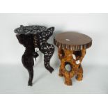 A carved wood and mother of pearl inlay, cast iron topped plant stand (41cm height) and one other.