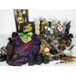 A mixed lot of collectables to include models of knights, wall plaques, Batman related items,