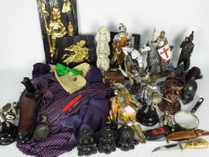 A mixed lot of collectables to include models of knights, wall plaques, Batman related items,