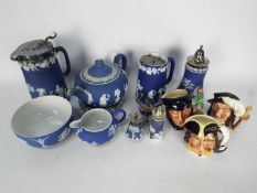 A collection of Wedgwood Jasperware and three small Royal Doulton character jugs.