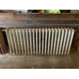 A Victorian, four bar, cast iron radiato