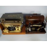 Two vintage sewing machines comprising a