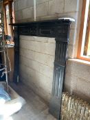 A Victorian cast iron fire surround meas