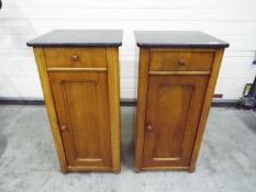A pair of bedside cabinets, approximatel