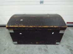A wooden chest with metal banding and ha