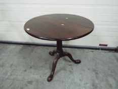 A mahogany tilt top table, approximately