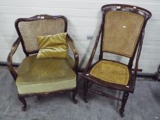 A mahogany chair with cane seat and back
