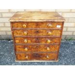 A small pine chest of graduated drawers,