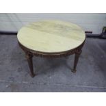 A brass and marble circular topped table