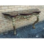 A console table of serpentine outline, a